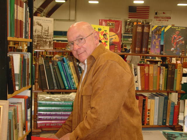 My dad looking through a New Hampshire History Book